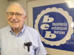 Bob in front of beb logo